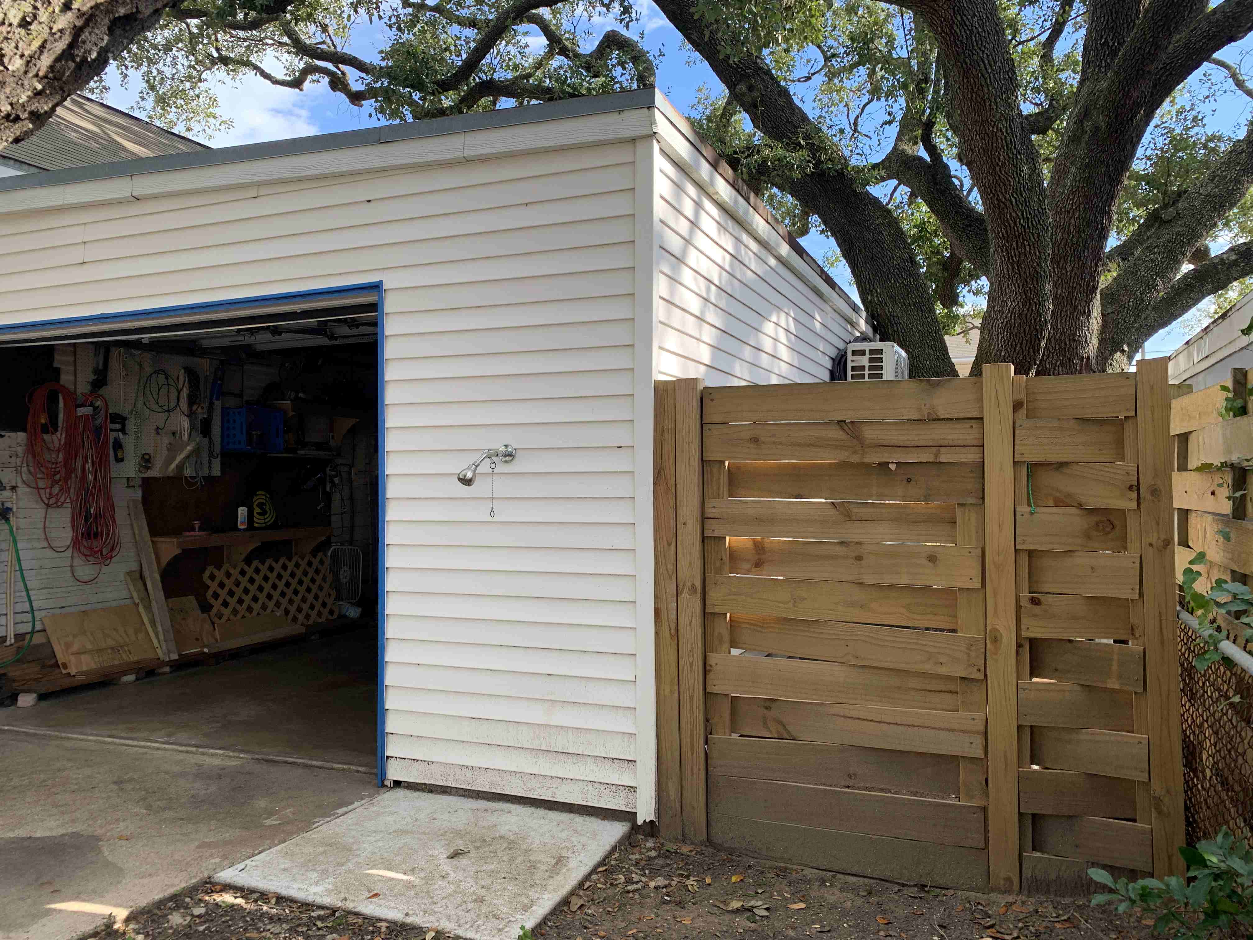 One car garage and gate to back - outdoor shower to clean sand off your feet